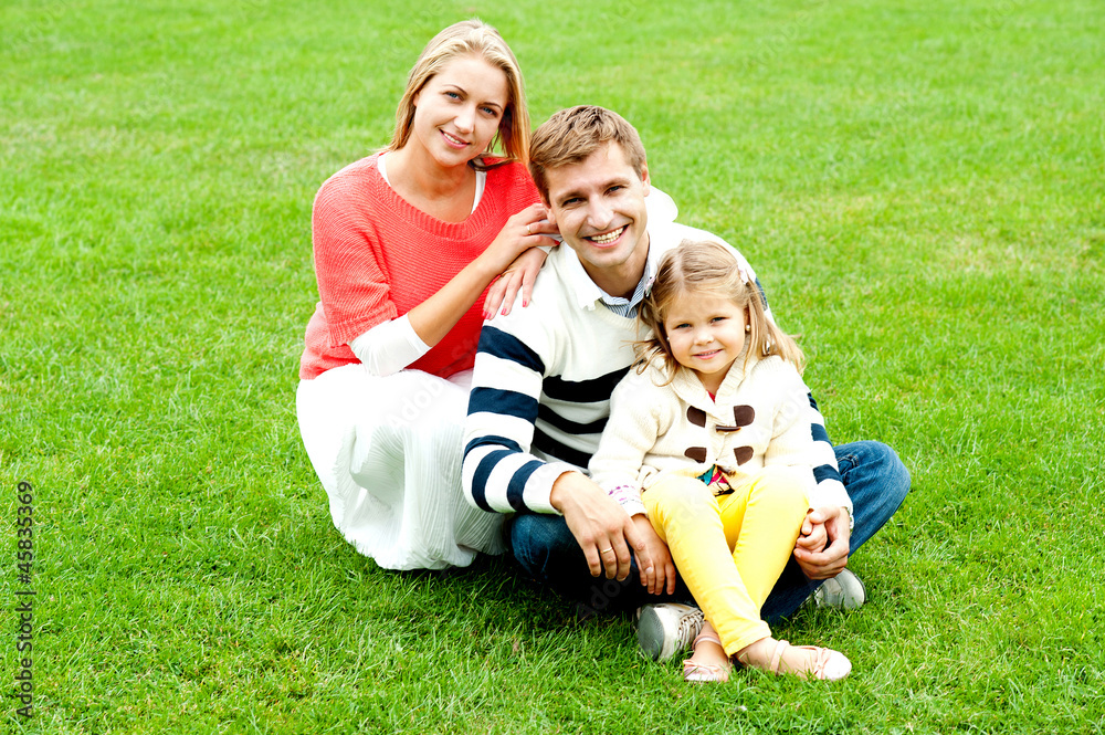Portrait of happy young family with daughter Portrait of happy young family with daughter