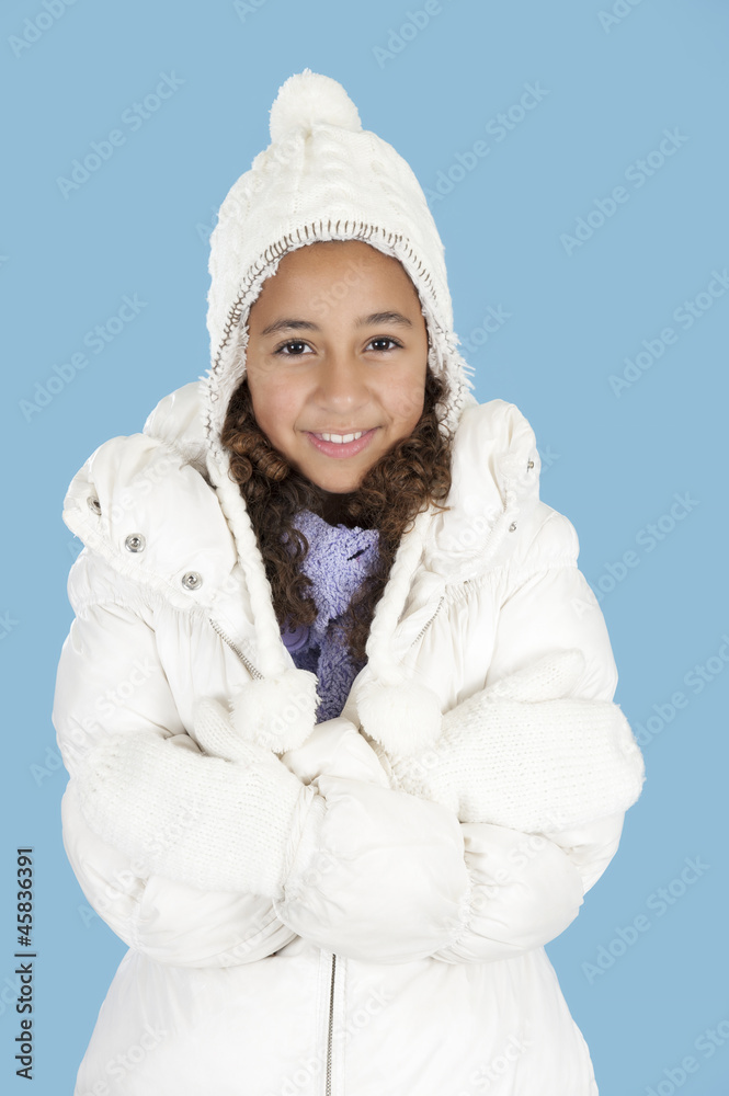 Happy girl with winter hat , on blue Happy girl with winter hat , on blue