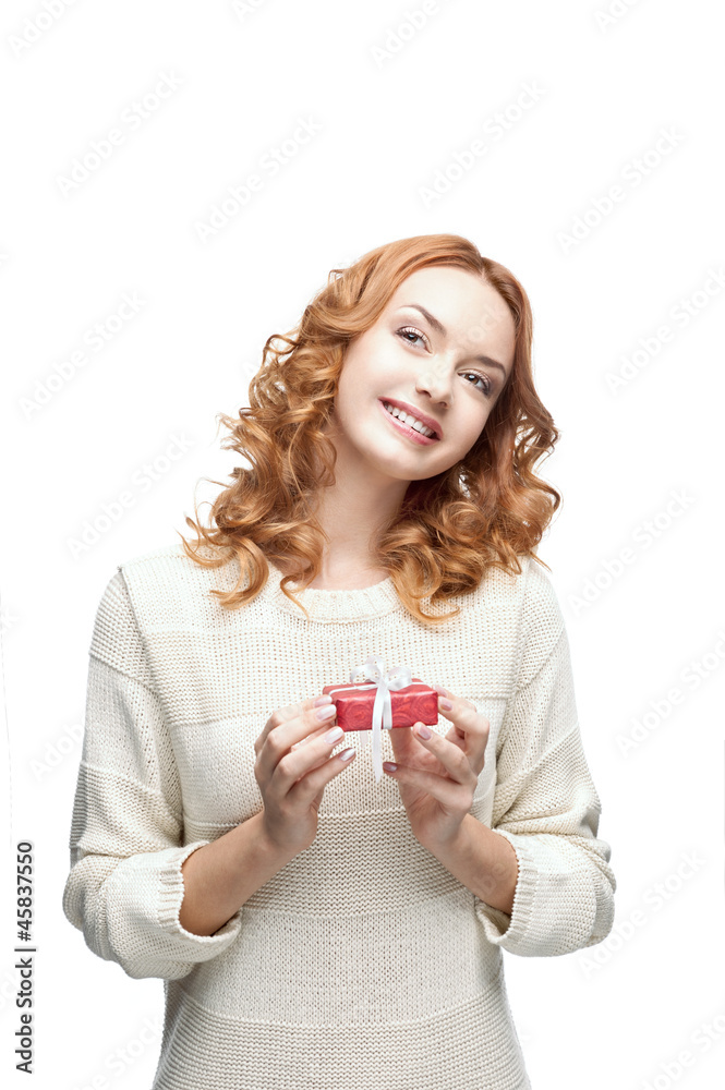 young red-haired happy smiling girl holding gift young red-haired happy smiling girl holding gift