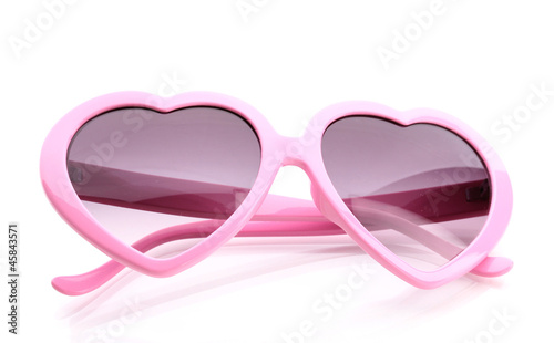 Pink heart-shaped sunglasses isolated on white