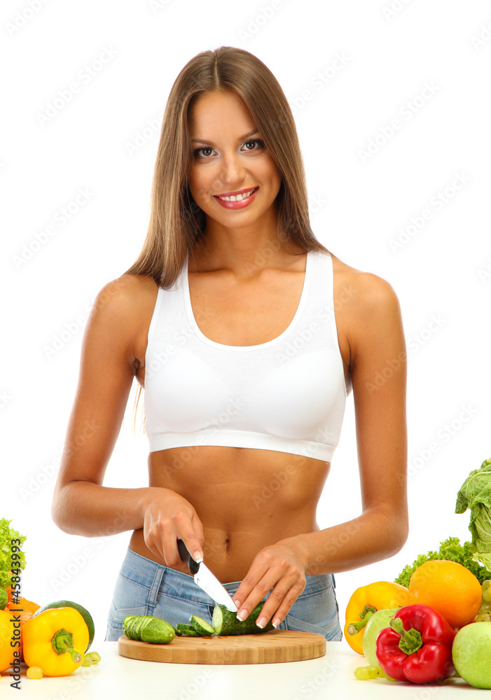 beautiful young woman cutting vegetables, isolated on white beautiful young woman cutting vegetables, isolated on white