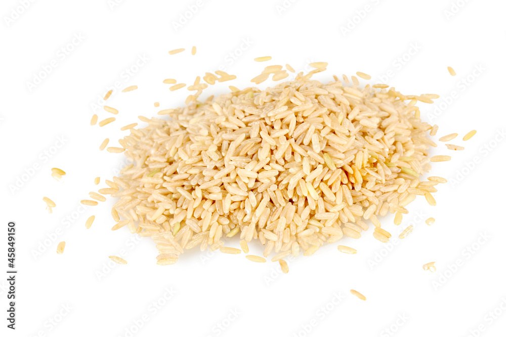 brown rice uncooked in a heap isolated on a white background brown rice uncooked in a heap isolated on a white background
