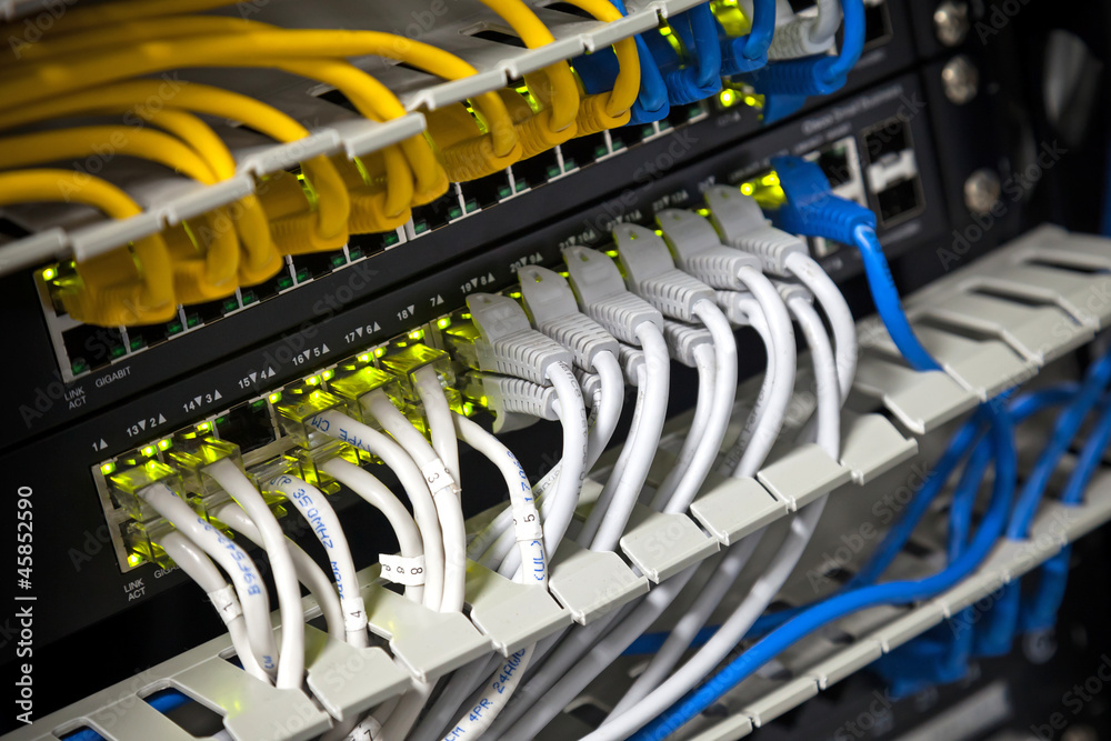Large network hub and connected Internet cables Large network hub and connected Internet cables