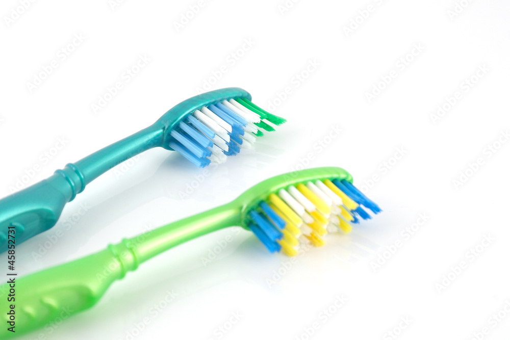 Two tooth-brushes over white Two tooth-brushes over white