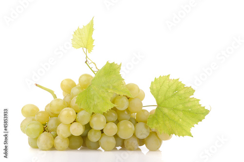 Branch of green grapes isolated on white