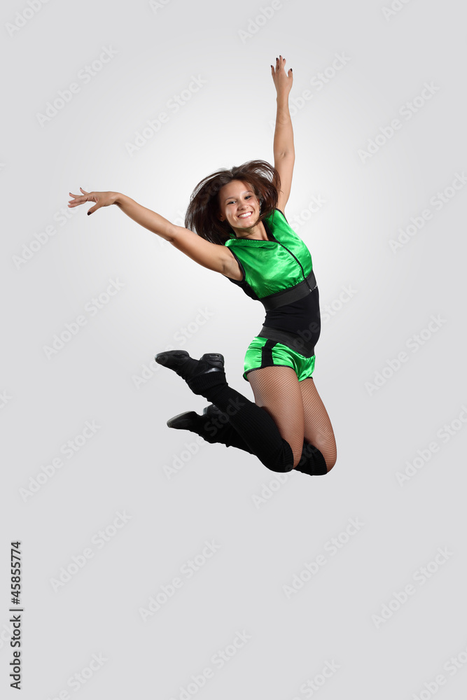 Young female dancer against white background Young female dancer against white background