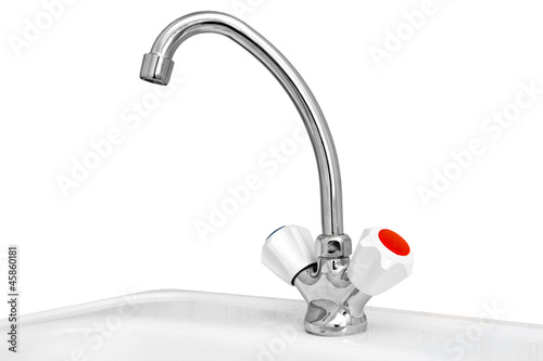The kitchen water crane is isolated on a white background
