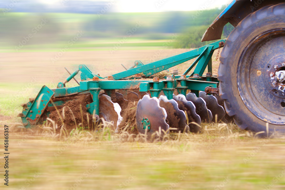 Naklejka premium Ploughing the field