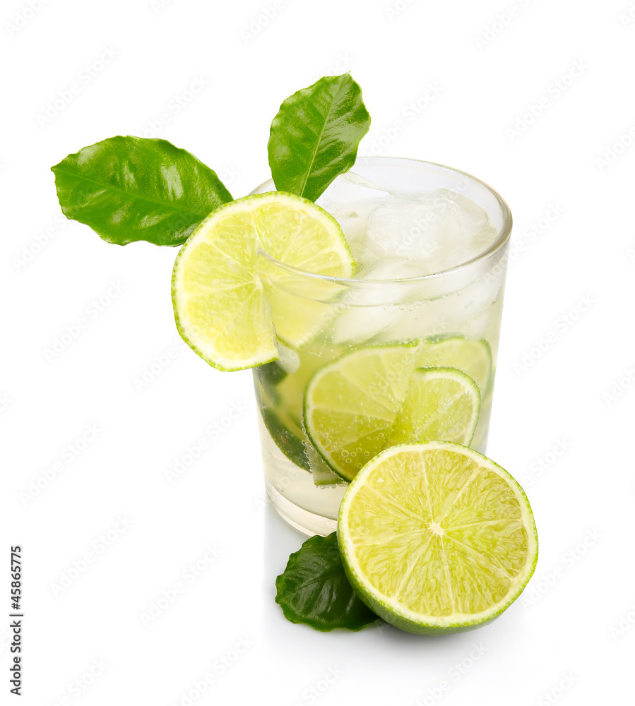 Full glass of fresh cool tonic with lime fruits isolated Full glass of fresh cool tonic with lime fruits isolated