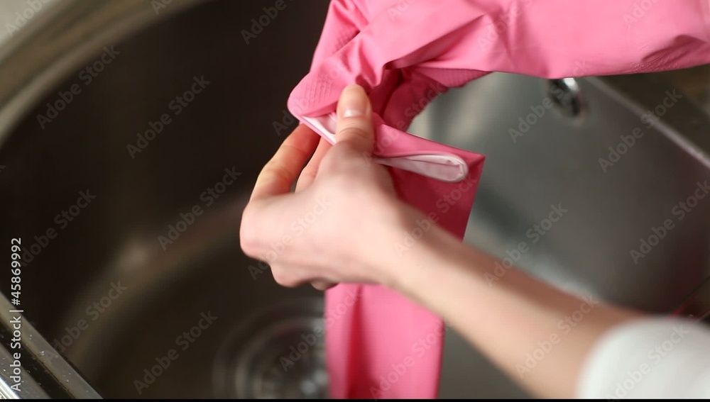 Putting rubber gloves on Putting rubber gloves on
