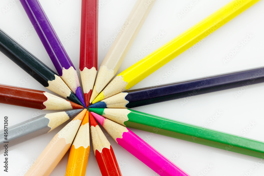 Row of colored pencils, on white background