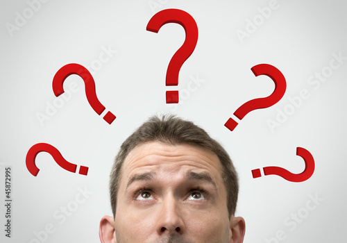 Man thinking concept with question marks close up
