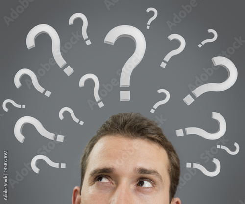 Man thinking concept with question marks close up