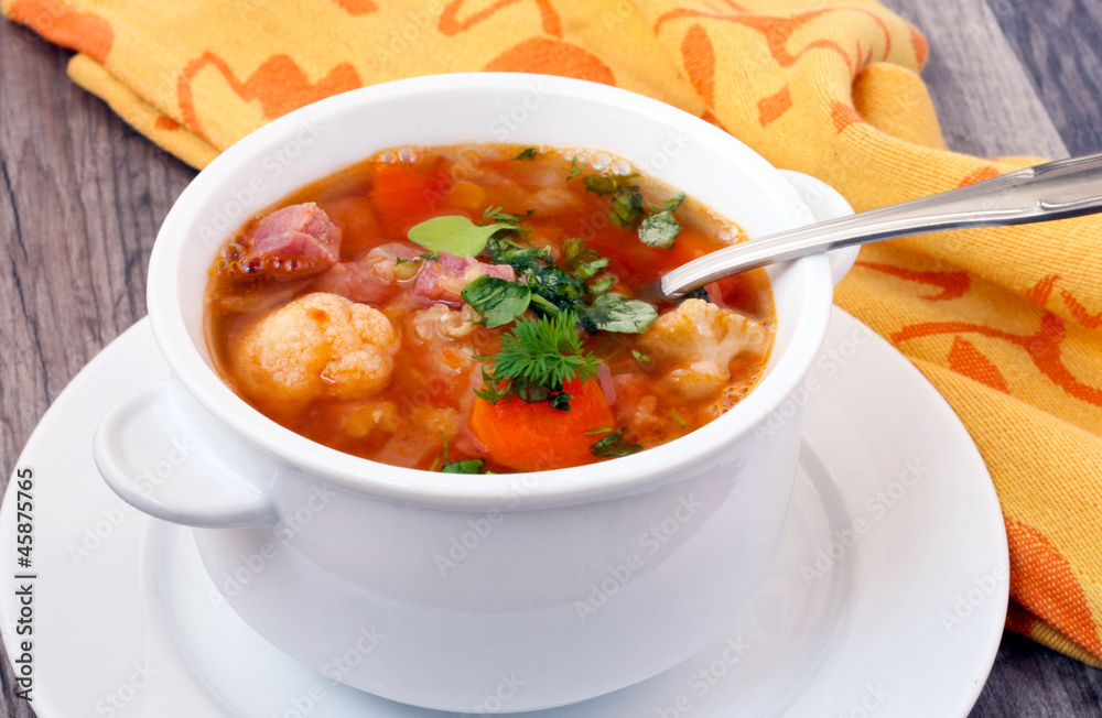 Cauliflower and red lentil soup with bacon and carrot