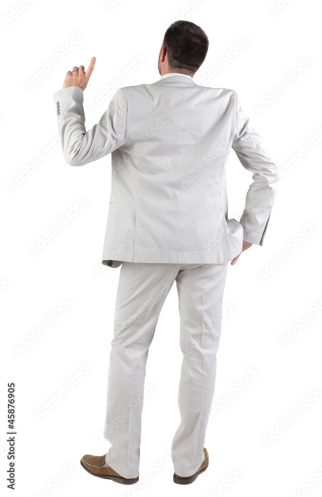 Back view of thinking young business man in white suit. Back view of thinking young business man in white suit.