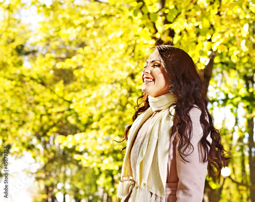 Woman wearing autumn coat outdoor.