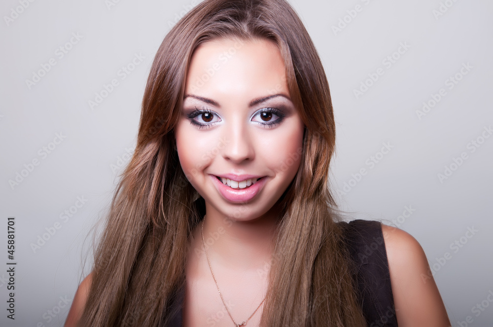 Fototapeta premium Teenage Girl on a grey Background. Teenager