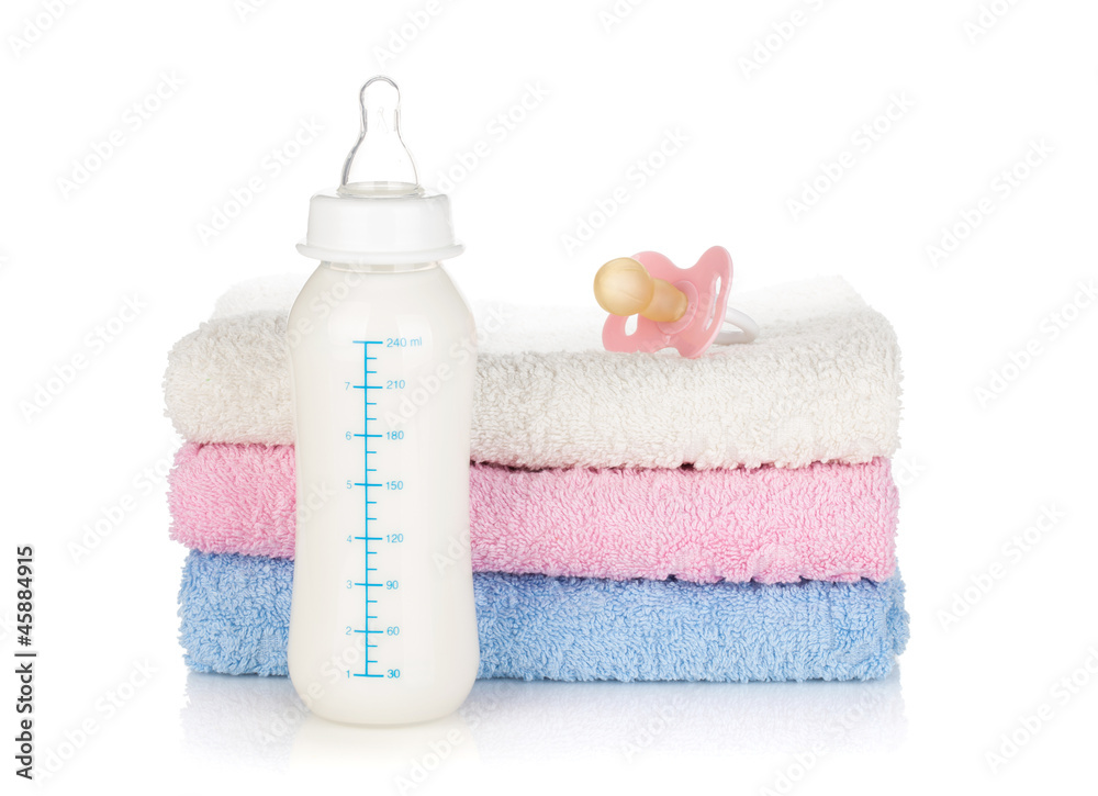 Baby bottle, pacifier and towels