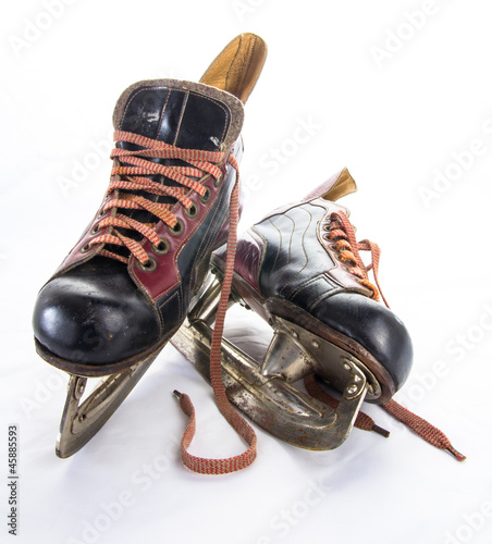 Photography Two very old ice hockey skates on white background