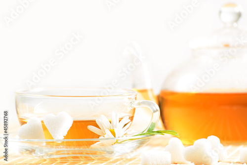 teacup with herbal chamomile tea