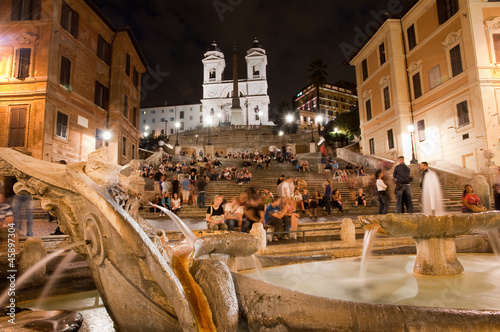 Night view at Piazza di Spagna fountain and trinita dei Monti Ro photo