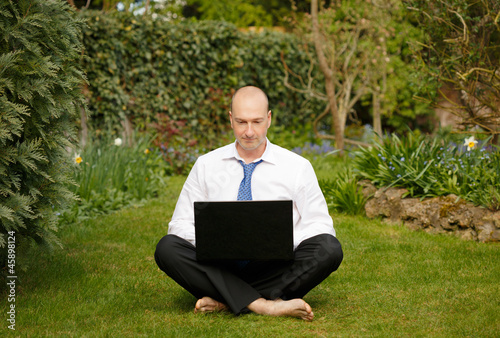 Businessman working outdoors photo