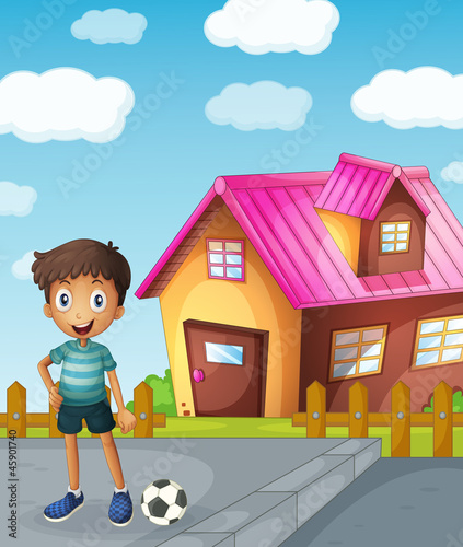 a boy, football and house