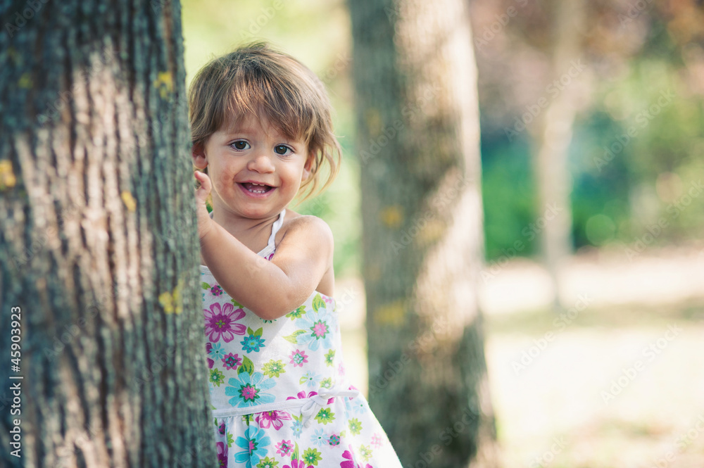 One year little girl playing in the park portrait. One year little girl playing in the park portrait.
