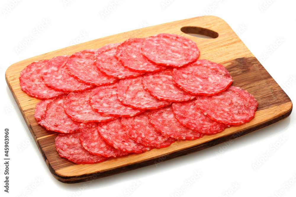 tasty sausage on wooden cutting board, isolated on white tasty sausage on wooden cutting board, isolated on white