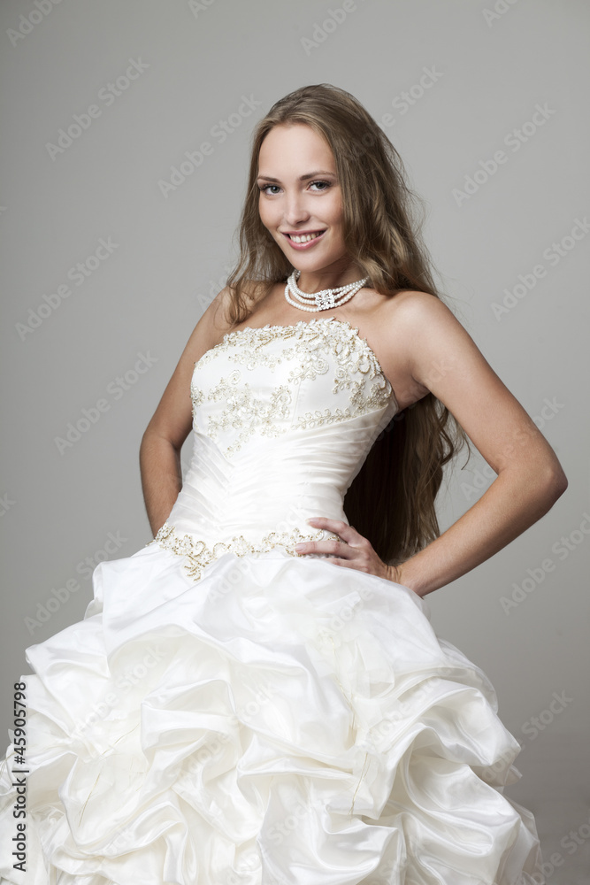 Fototapeta premium beautiful smiling girl in a white wedding dress