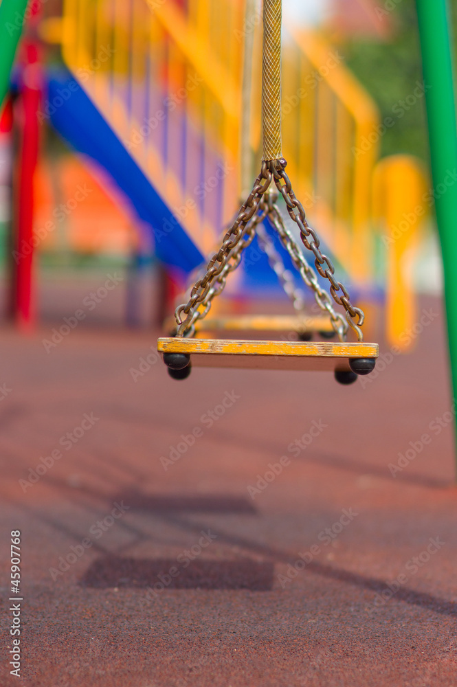 Fototapeta premium Empty chain swings on summer kids playground