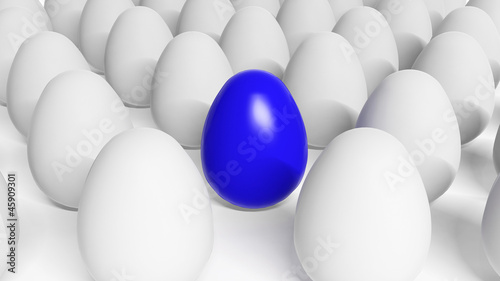 Blue Easter egg among white eggs