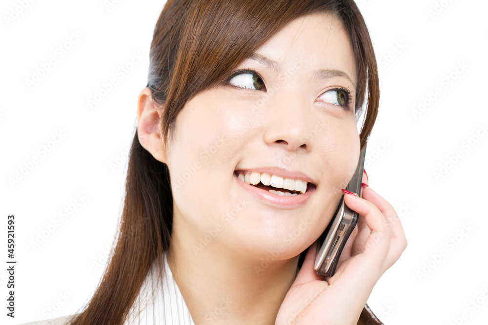 Beautiful young businesswoman using a cellular phone. Portrait o Beautiful young businesswoman using a cellular phone. Portrait o