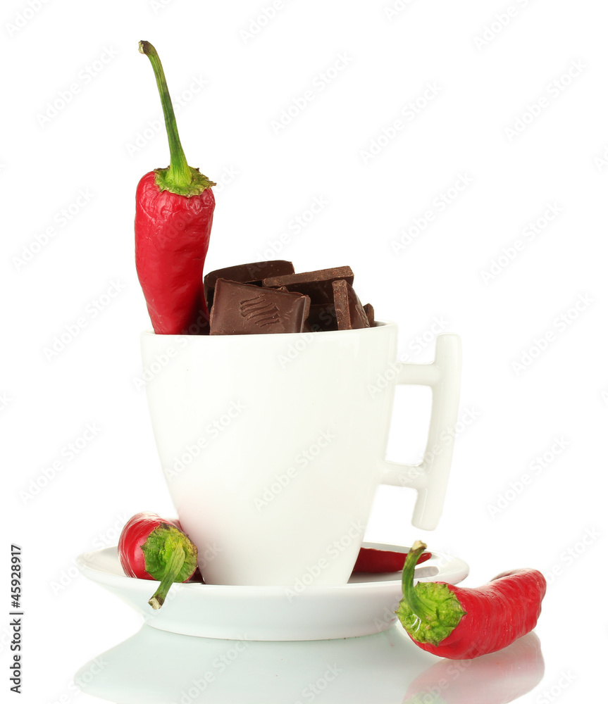 white cup with hot chocolate and chili pepper isolated on white white cup with hot chocolate and chili pepper isolated on white