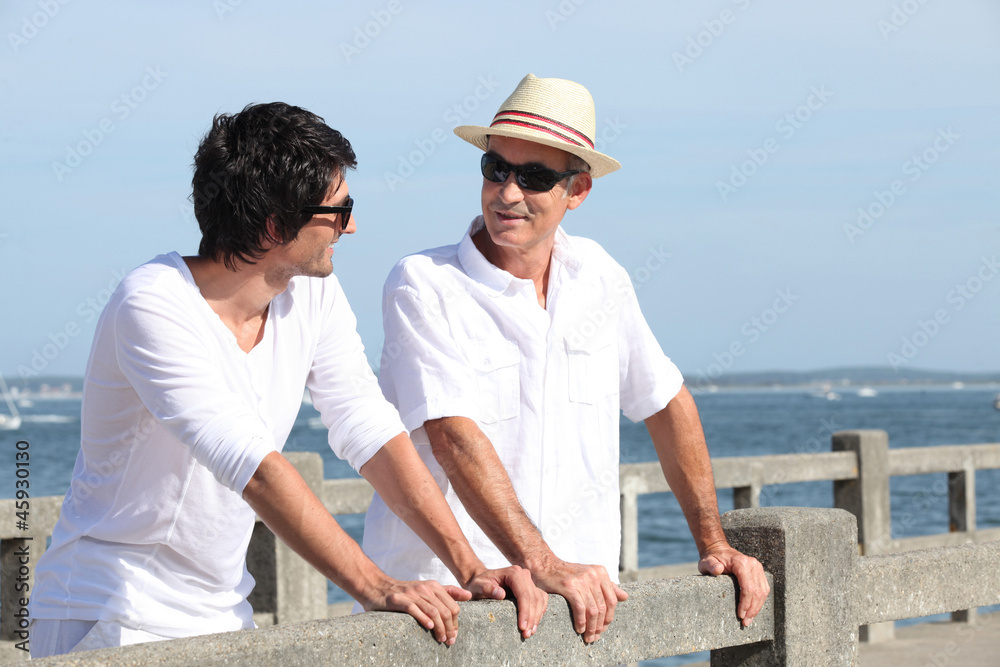 Father and son stood on promenade