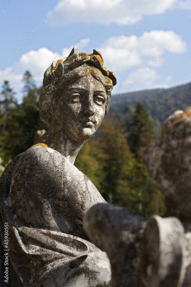 stone statues decorating peles castle gardens