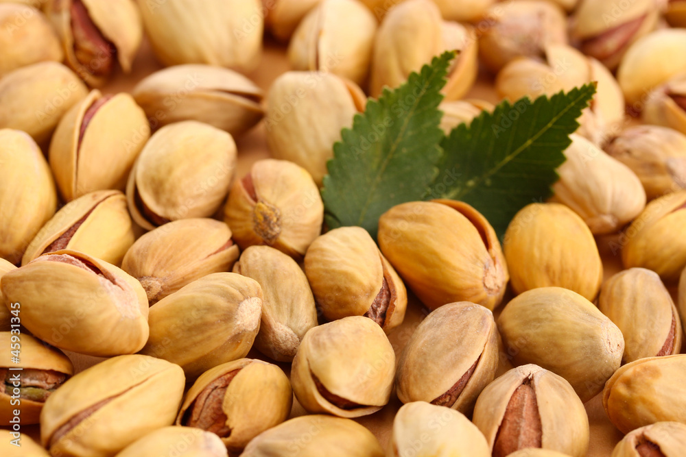 tasty pistachio nuts with leaves, close up tasty pistachio nuts with leaves, close up