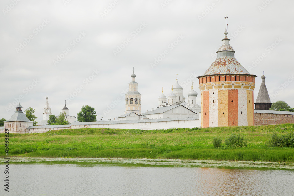 Saviour Prilutskyl Monastery near river, lawn in Vologda, Russia