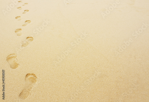 footprints in the sand background photo