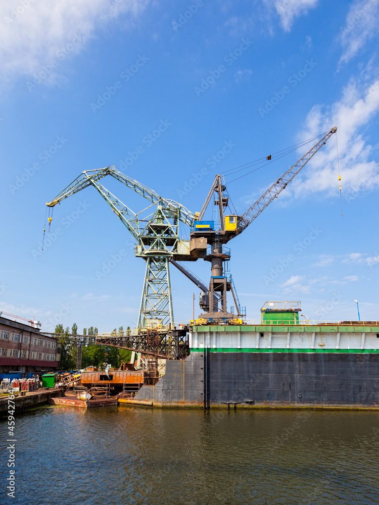 Big cranes and dock at the shipyard in Gdansk, Poland.