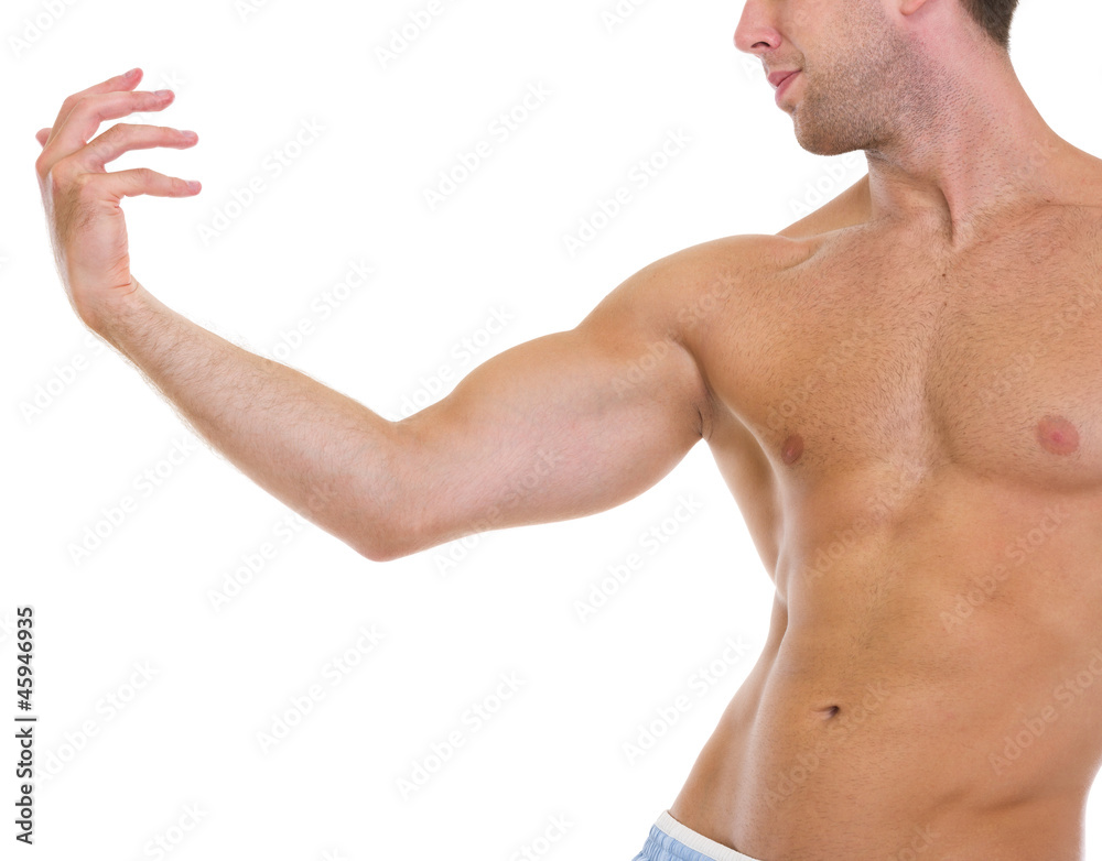 Closeup on muscular man gracefully posing Closeup on muscular man gracefully posing