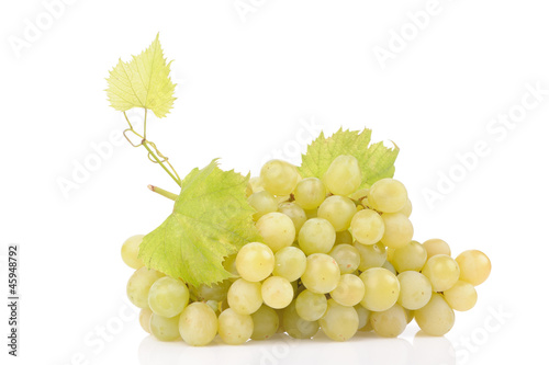 Branch of green grapes isolated on white