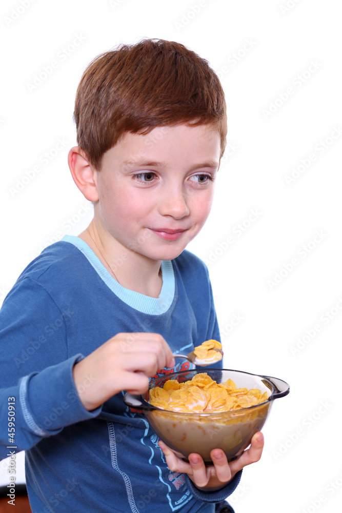 Little boy breakfast isolated over white background Little boy breakfast isolated over white background