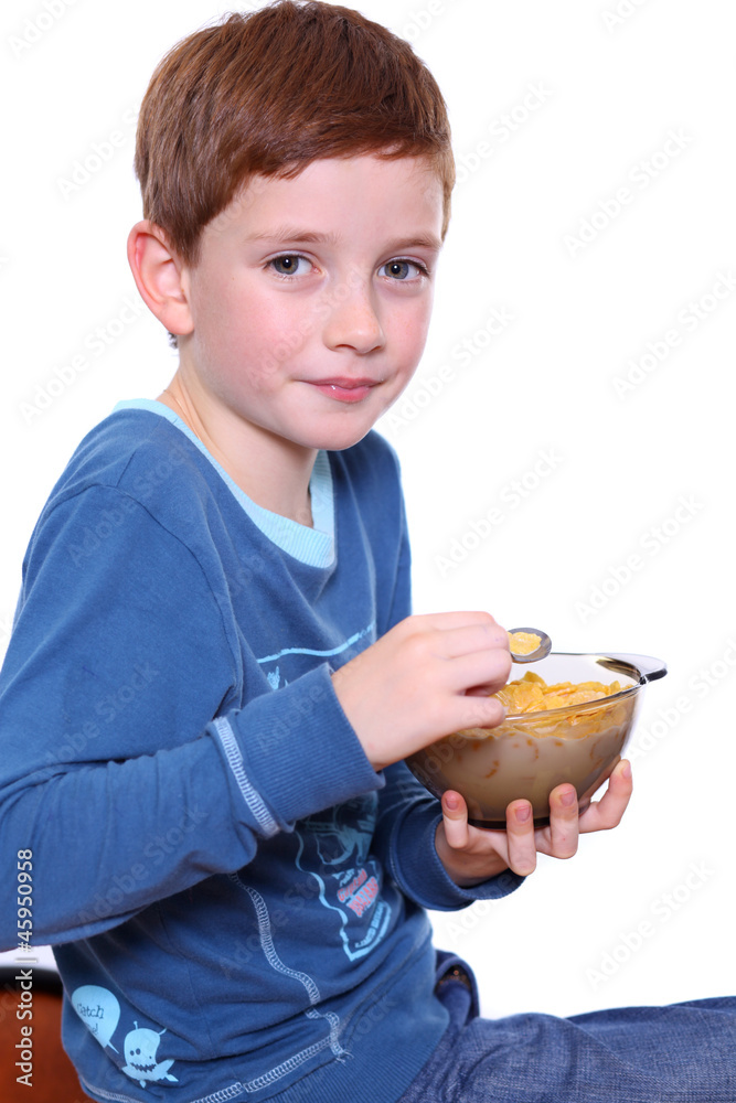 Little boy breakfast isolated over white background Little boy breakfast isolated over white background