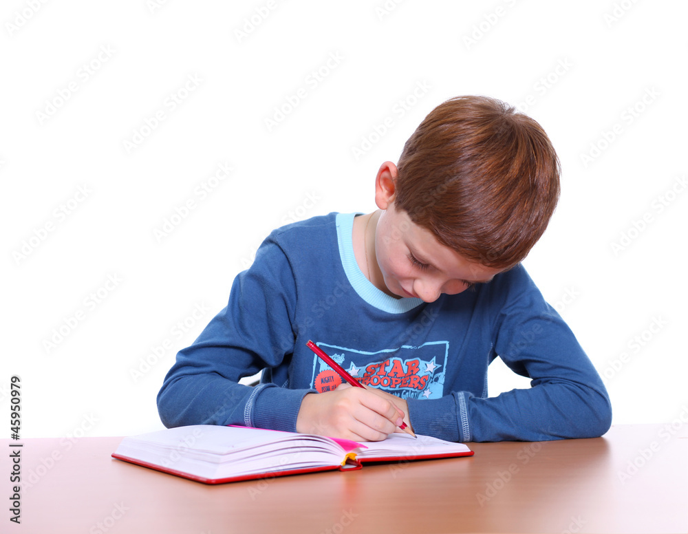 beautiful little boy sitting at the table beautiful little boy sitting at the table