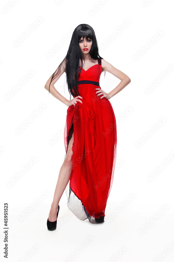 Beautiful young lady wearing red dress isolated on white