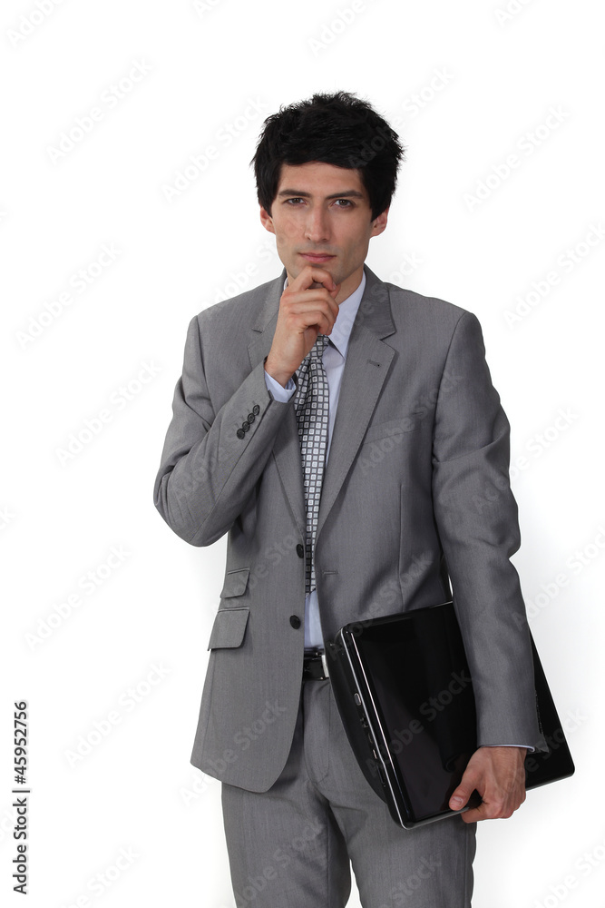 Pensive salesman holding folder