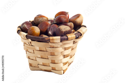basket of chestnuts, autumn fruits, isolated on white