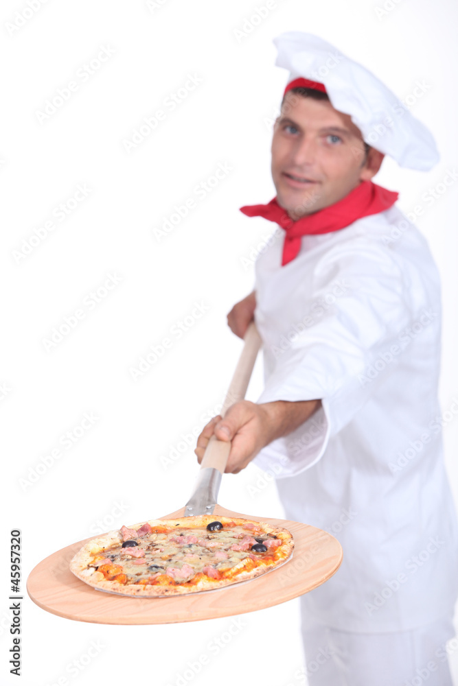 Pizza chef with a wooden peel