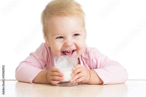 little child drinking yogur...